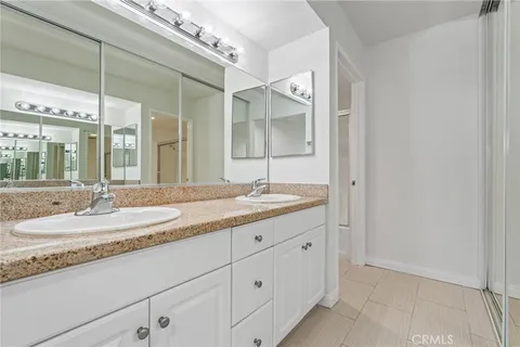 a bathroom with a sink and mirror