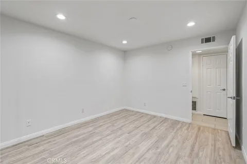 an outdoor living room with furniture and a large window