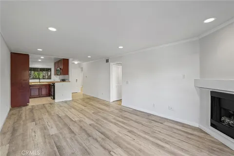 a bedroom with a large bed and a couch