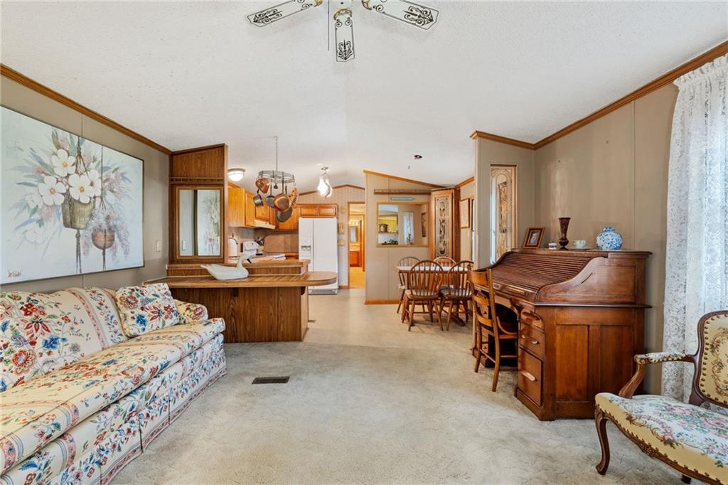 385 Garner Road Edinburg, PA 16116 - Photo 13 of 31 a living room with furniture and a flat screen tv