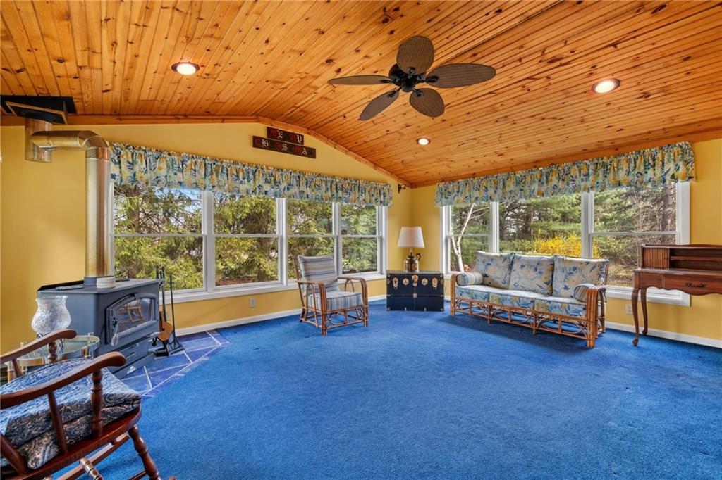385 Garner Road Edinburg, PA 16116 - Photo 16 of 31 a living room with furniture and a flat screen tv