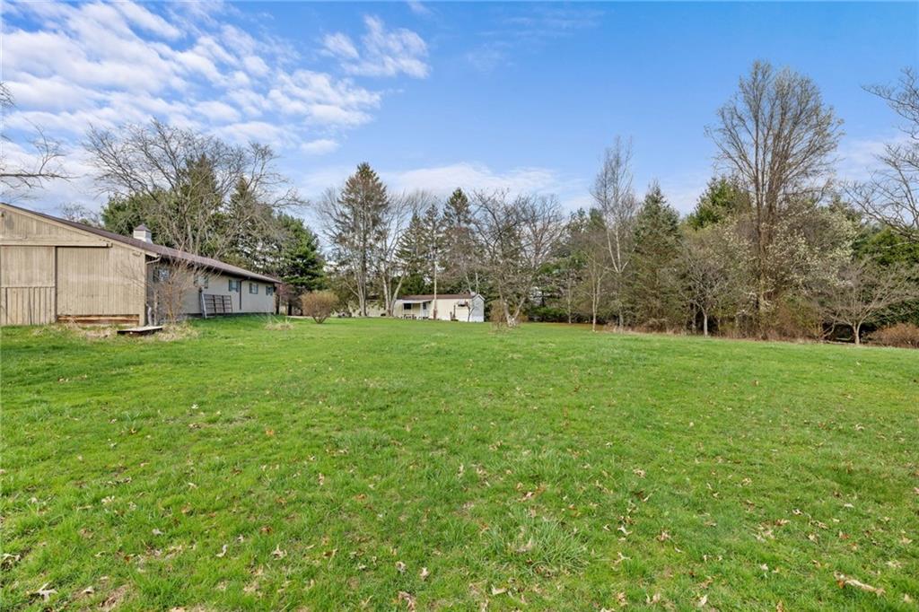 385 Garner Road Edinburg, PA 16116 - Photo 28 of 31 a view of a house with a yard