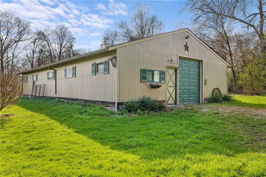 385 Garner Road Edinburg, PA 16116 - Photo 4 of 31 a view of a back yard of the house