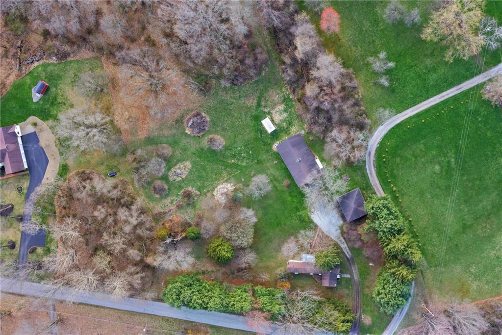 385 Garner Road Edinburg, PA 16116 - Photo 5 of 31 a backyard of a house with lots of green space