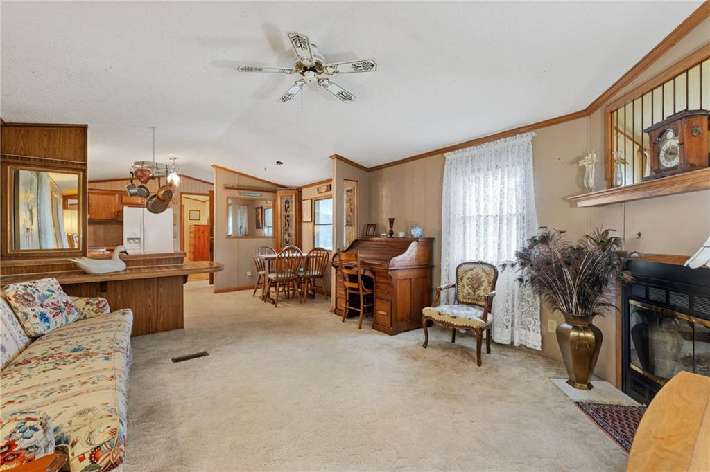 385 Garner Road Edinburg, PA 16116 - Photo 6 of 31 a living room with furniture and a dining table
