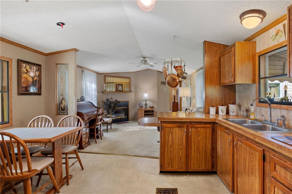 385 Garner Road Edinburg, PA 16116 - Photo 10 of 31 a kitchen with lots of counter top space and dining table