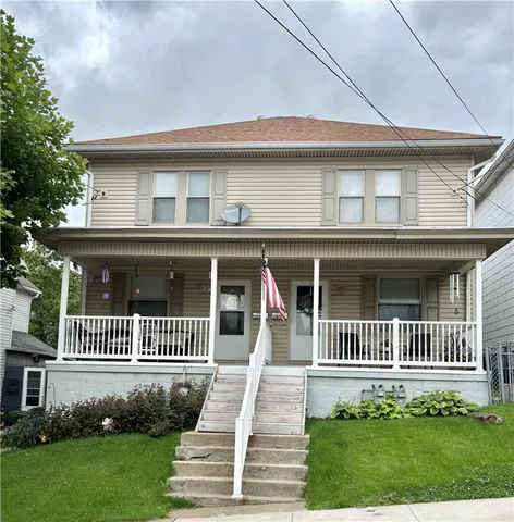 a front view of a house with a porch