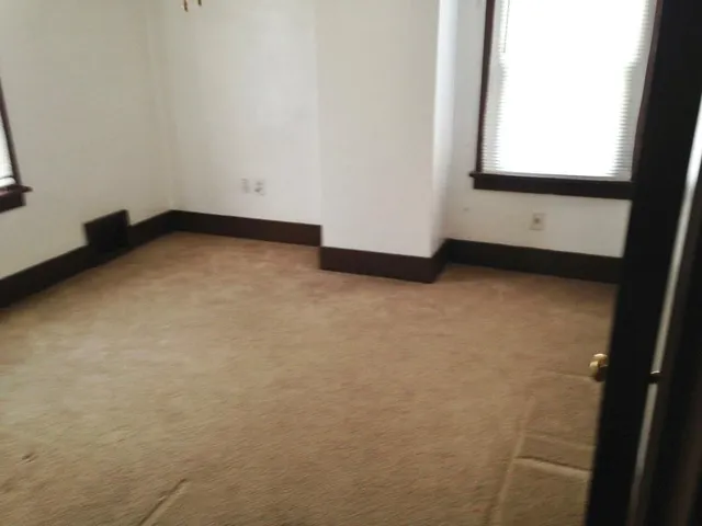 a view of a house with backyard and windows