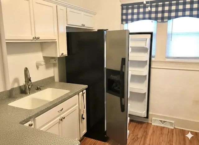 a kitchen view of a stove and a microwave