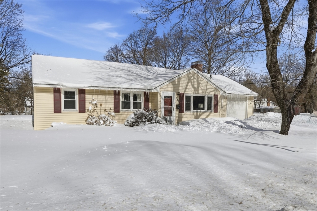 153 Summer Street Maynard, MA 01754 - Photo 1 of 26 a front view of a house with yard and parking