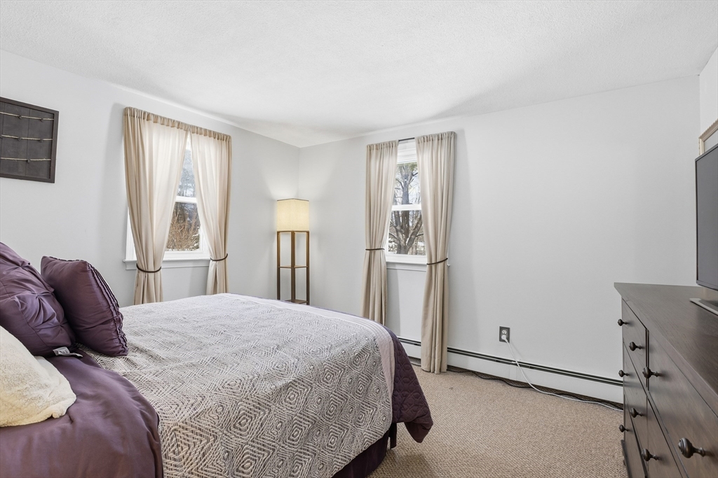 153 Summer Street Maynard, MA 01754 - Photo 15 of 26 a bedroom with a bed and a window