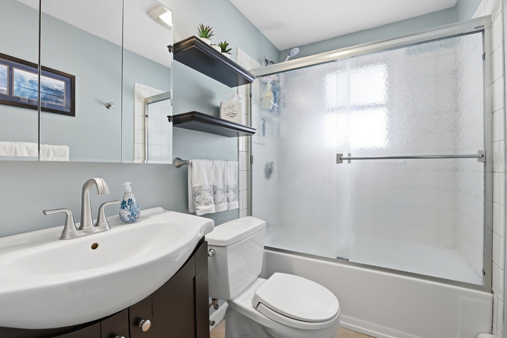 153 Summer Street Maynard, MA 01754 - Photo 18 of 26 a bathroom with a sink toilet and shower
