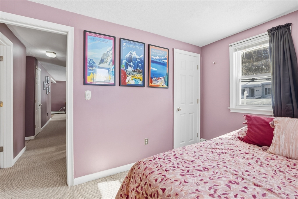 153 Summer Street Maynard, MA 01754 - Photo 21 of 26 a bedroom with a bed and a window