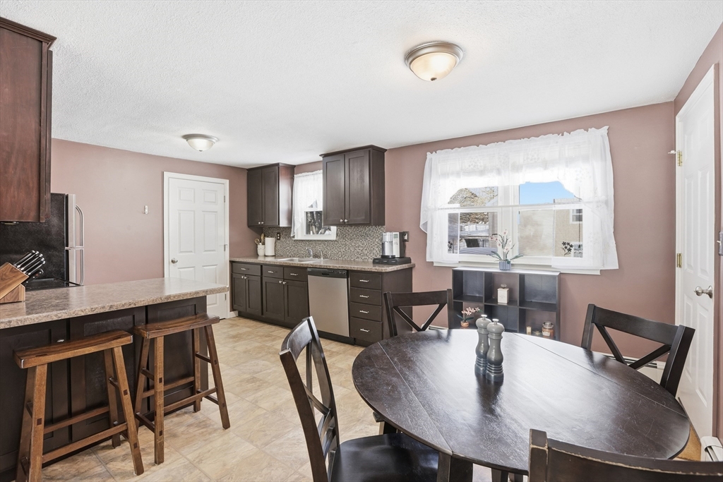 153 Summer Street Maynard, MA 01754 - Photo 7 of 26 a view of a dining room with furniture and wooden floor