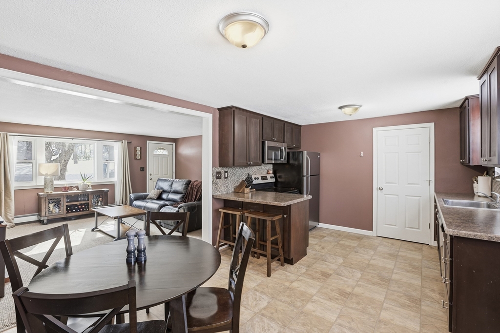 153 Summer Street Maynard, MA 01754 - Photo 8 of 26 a view of a dining room with furniture