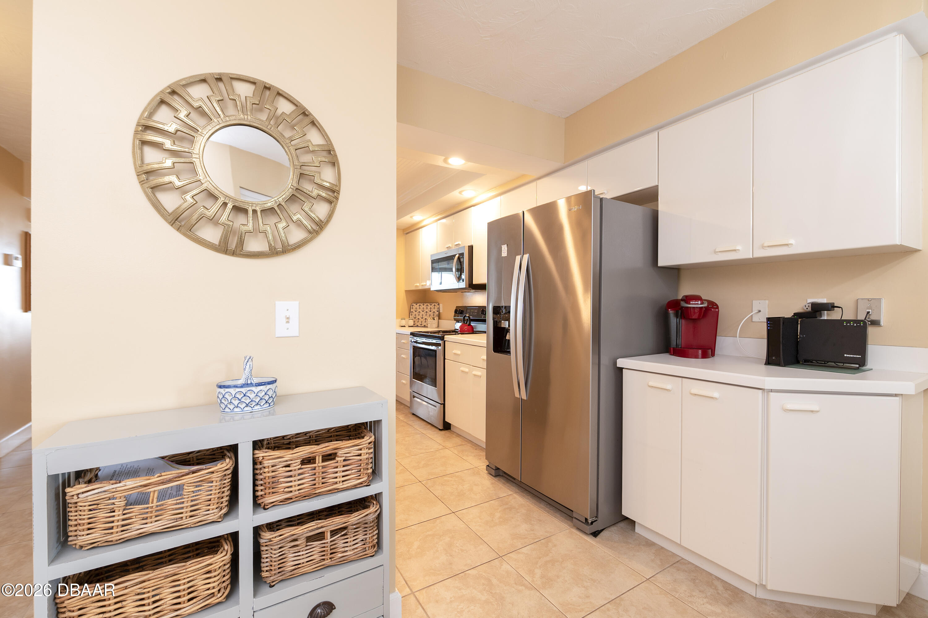 4575 South Atlantic Avenue, Unit 6701 Ponce Inlet, FL 32127 - Photo 12 of 35 a kitchen with stainless steel appliances granite countertop a refrigerator and a stove