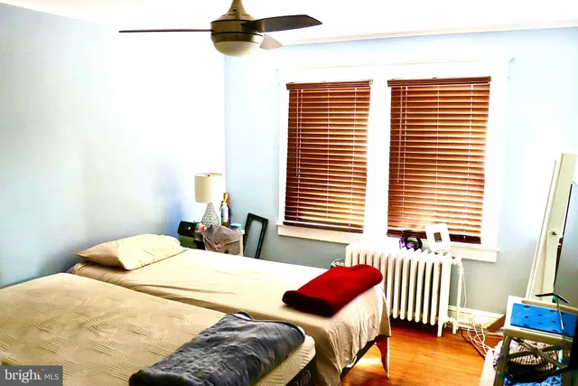 a bedroom with a bed and a table