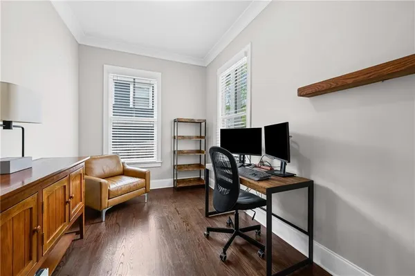 a workspace with furniture and a window