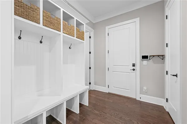 a view of an entryway with wooden floor