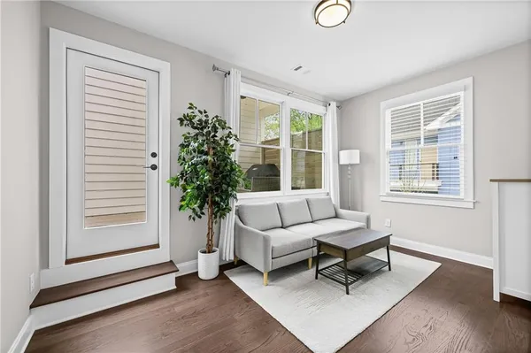 a living room with furniture and a window
