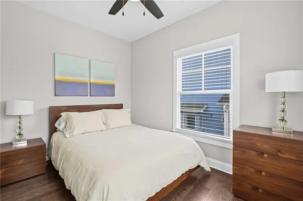 a bedroom with a bed and a night stand