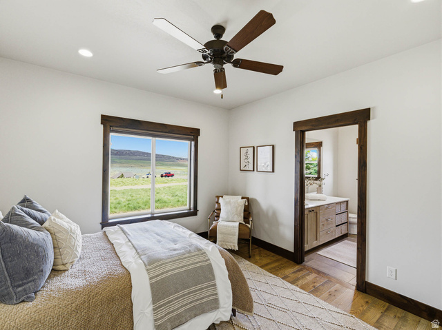 402 Shadow Hill Road Wanship, UT 84017 - Photo 33 of 90 Bedroom with light wood finished floors, recessed lighting, a ceiling fan, and connected bathroom