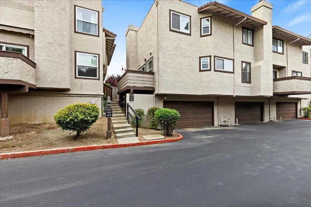 a front view of a house with garage