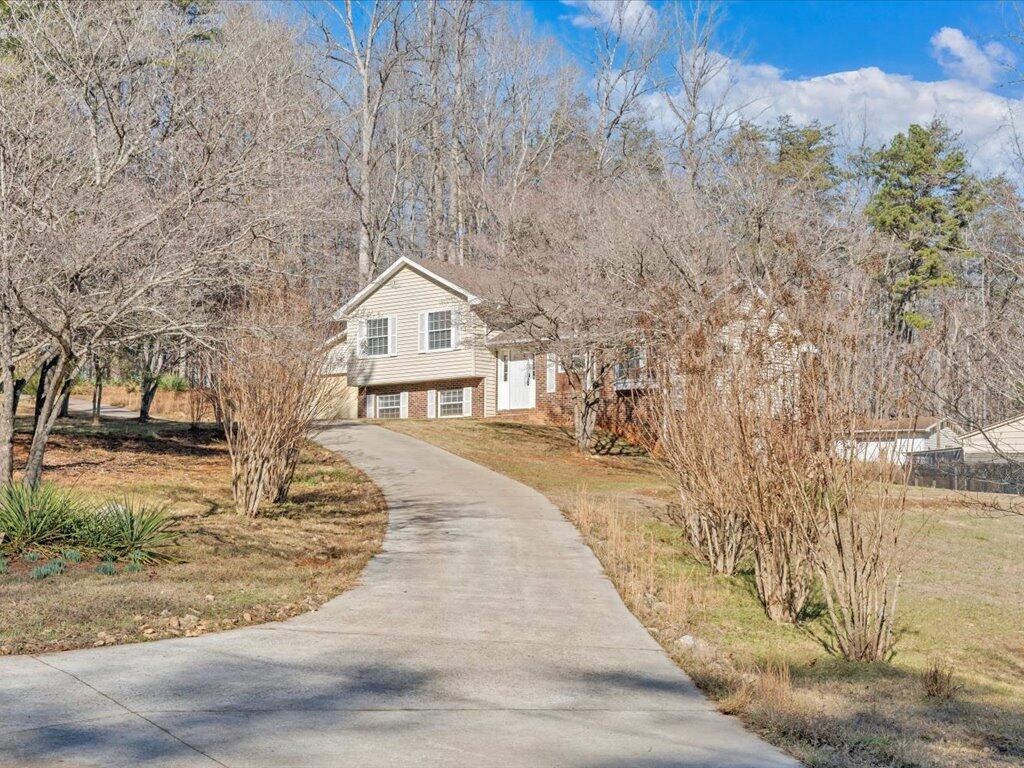 1511 Eggleston Falls Road Ridgeway, VA 24148 - Photo 102 of 151 a view of house with yard and trees in the background