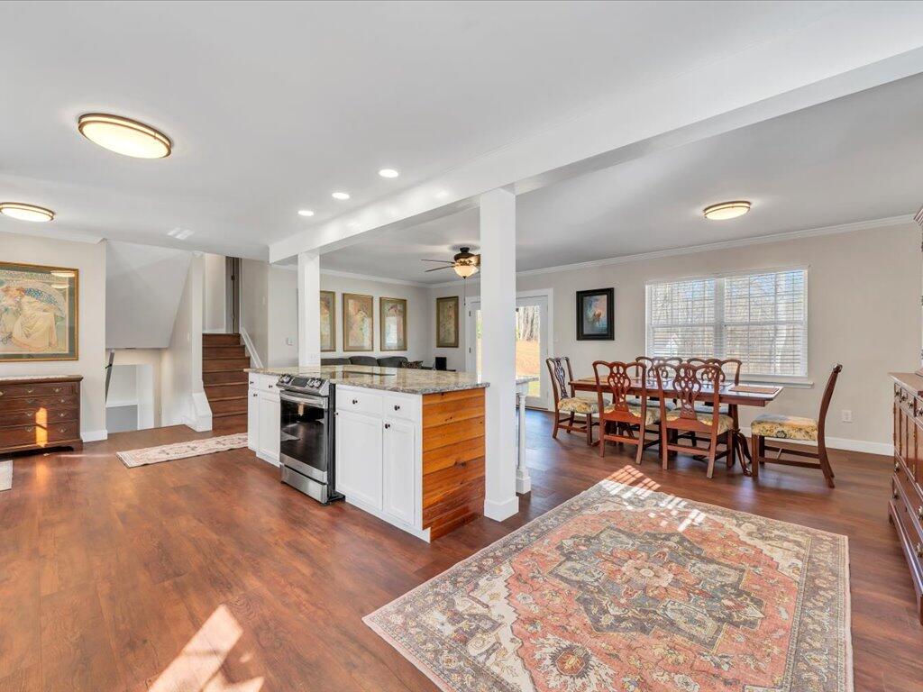 1511 Eggleston Falls Road Ridgeway, VA 24148 - Photo 15 of 151 a living room with furniture and a dining table with kitchen view