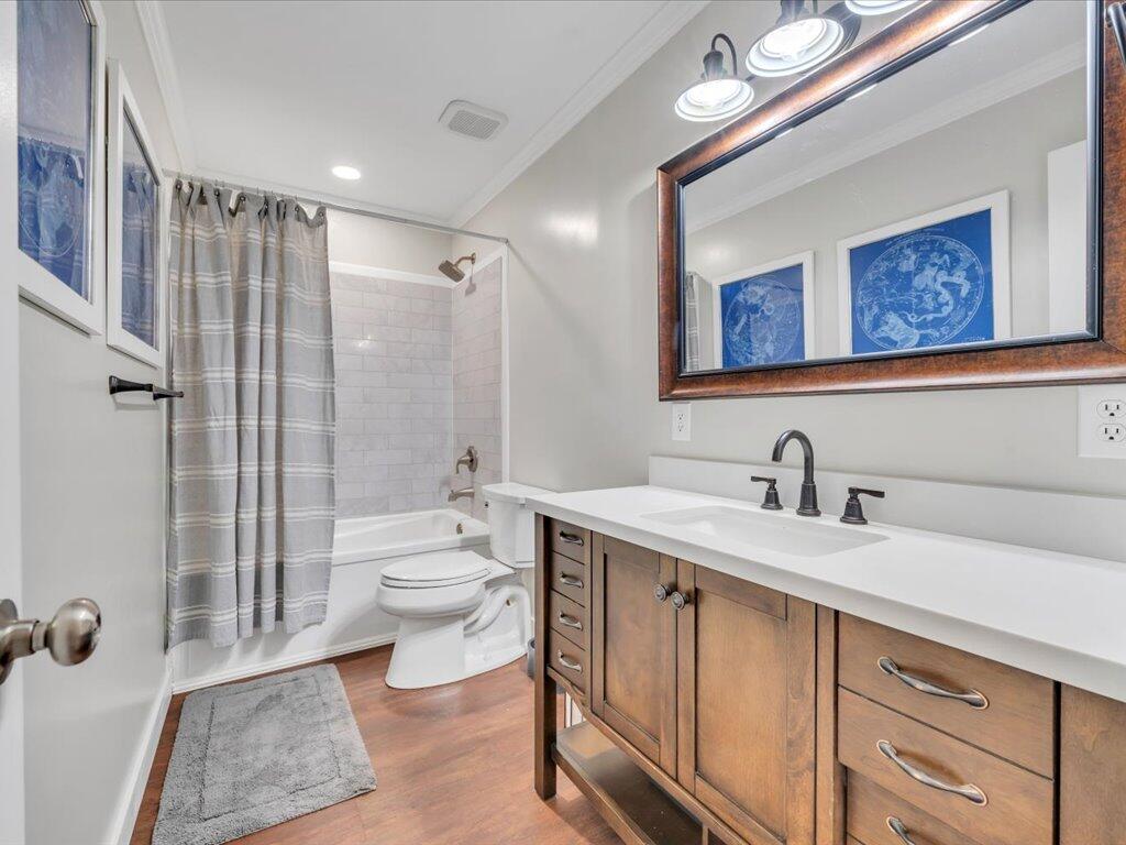 1511 Eggleston Falls Road Ridgeway, VA 24148 - Photo 37 of 151 a bathroom with a toilet a sink a mirror a shower a vanity and window