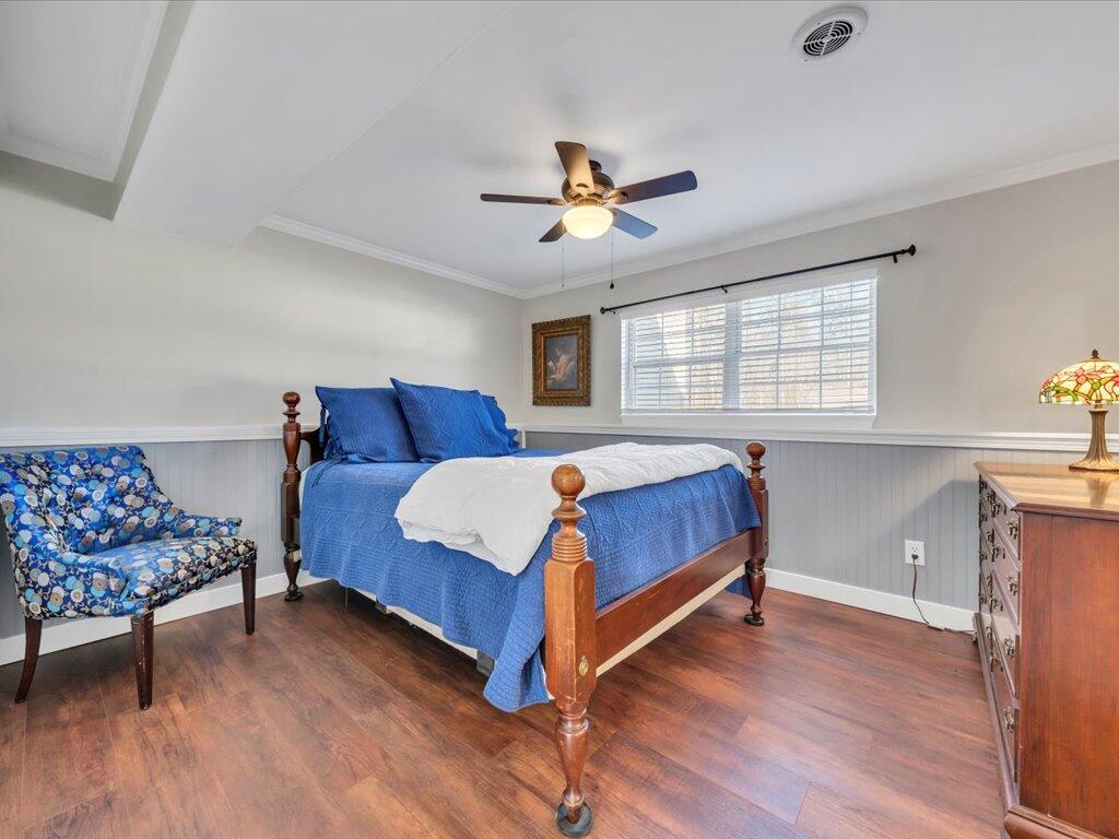 1511 Eggleston Falls Road Ridgeway, VA 24148 - Photo 44 of 151 a bedroom with a bed and wooden floor