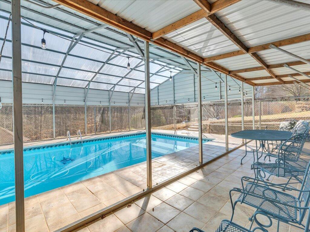1511 Eggleston Falls Road Ridgeway, VA 24148 - Photo 64 of 151 a view of swimming pool with outdoor seating