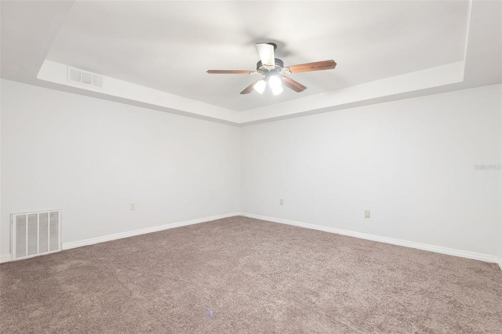 6225 Bayside Drive New Port Richey, FL 34652 - Photo 43 of 84 an empty room with a window and ceiling fan