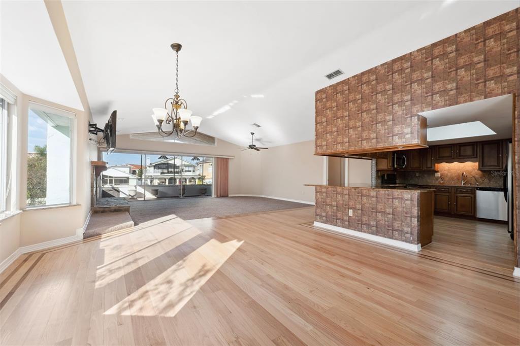 6225 Bayside Drive New Port Richey, FL 34652 - Photo 7 of 84 a view of living room with furniture and a chandelier
