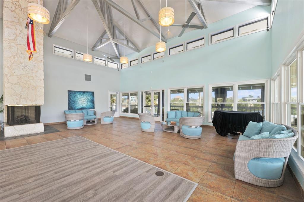 6225 Bayside Drive New Port Richey, FL 34652 - Photo 72 of 84 a living room with furniture and a chandelier