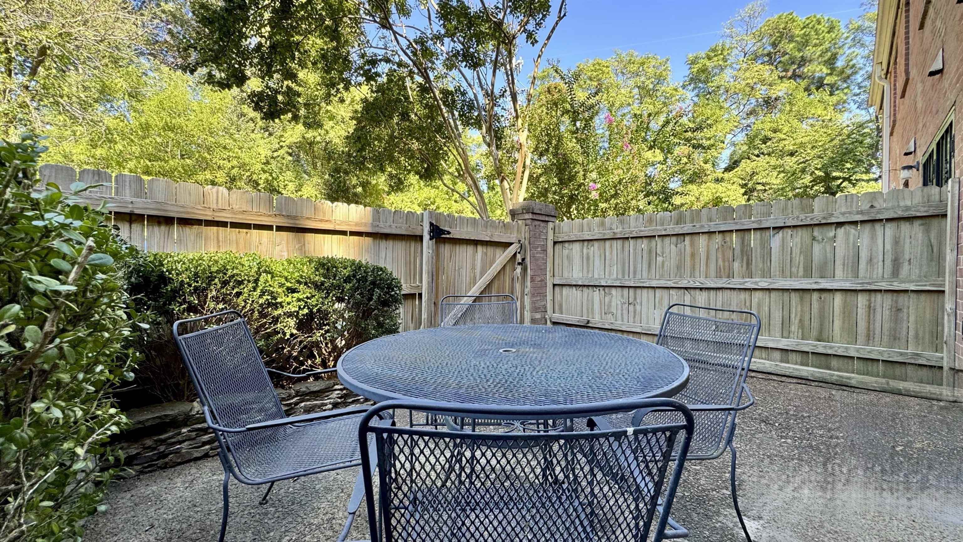 5718 Quince Road, Unit 10 Memphis, TN 38119 - Photo 21 of 28 Fenced backyard featuring outdoor dining space and a patio