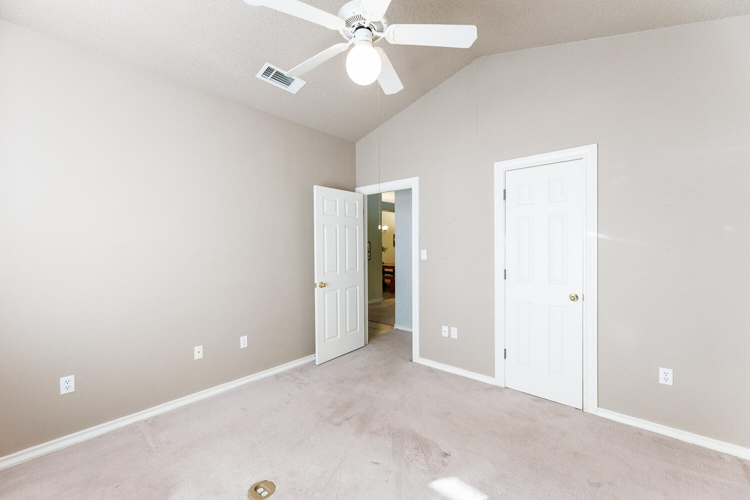 206 Collins Avenue Sundown, TX 79372 - Photo 51 of 82 a view of an empty room with a ceiling fan