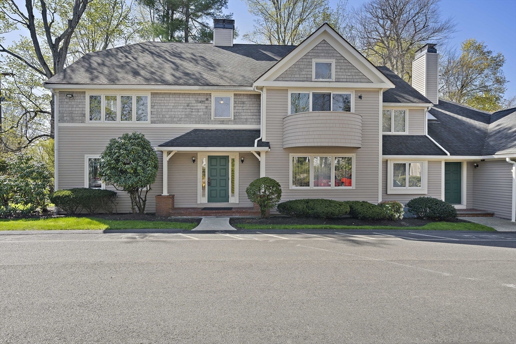 20 Jasper Lane, Unit 20 Randolph, MA 02368 - Photo 1 of 13 a front view of a house with a yard and garage