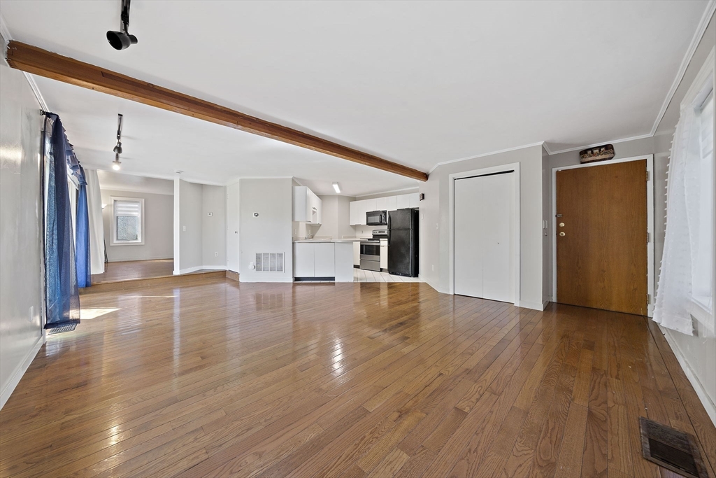 20 Jasper Lane, Unit 20 Randolph, MA 02368 - Photo 3 of 13 a view of empty room with wooden floor