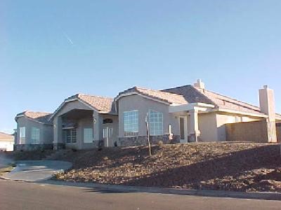 13351 Choco Road Apple Valley, CA 92308 - Photo 1 of 1 a front view of a house with a garden