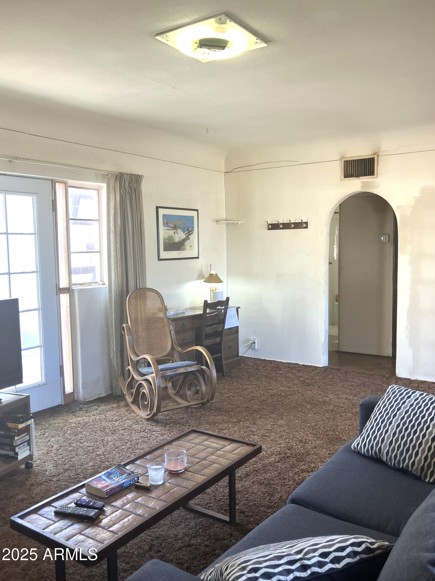 1637 East Roma Avenue Phoenix, AZ 85016 - Photo 14 of 78 a living room with furniture and a window