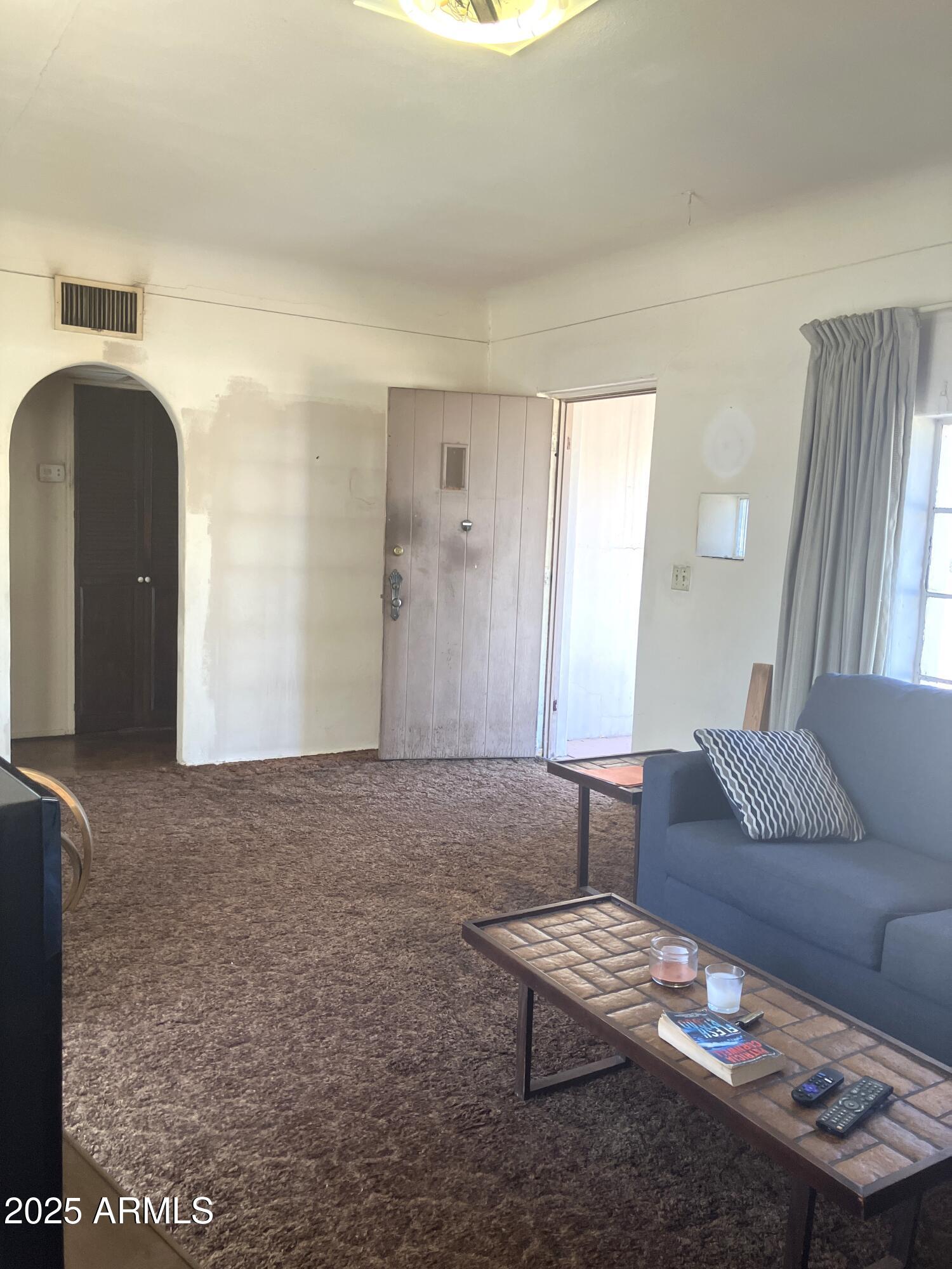 1637 East Roma Avenue Phoenix, AZ 85016 - Photo 15 of 78 a living room with furniture and a window