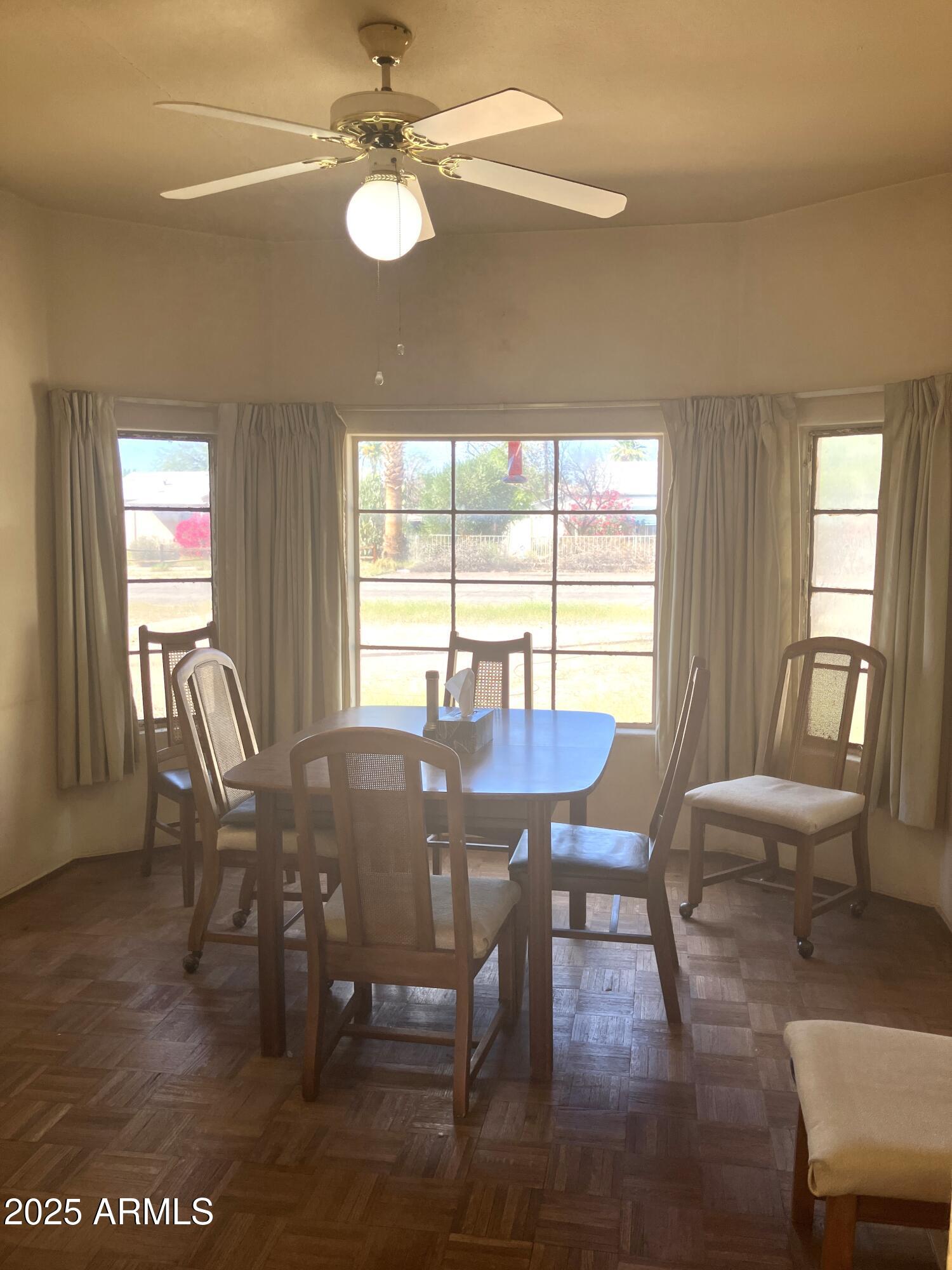 1637 East Roma Avenue Phoenix, AZ 85016 - Photo 18 of 78 a view of a dining room with furniture window and wooden floor