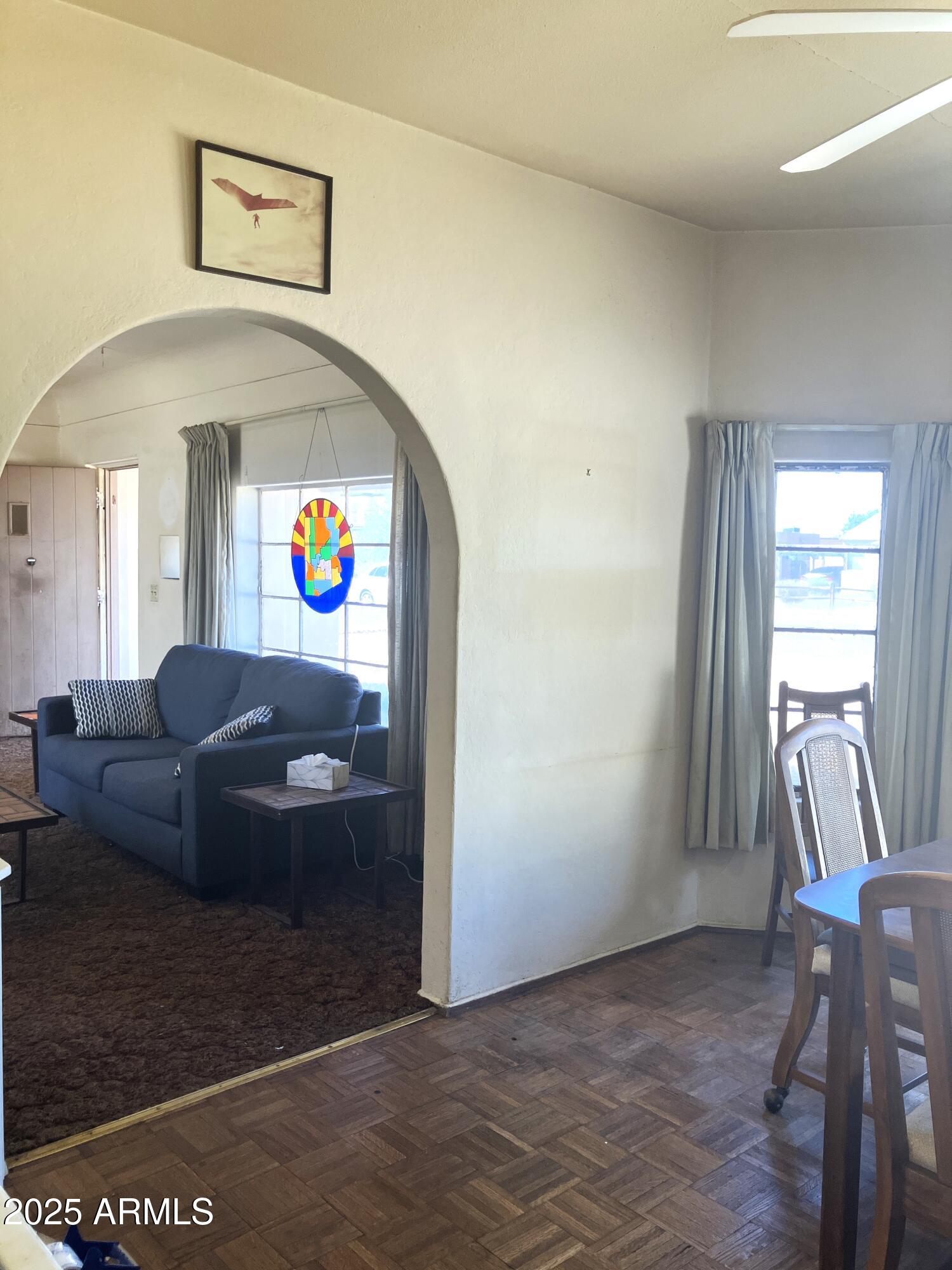 1637 East Roma Avenue Phoenix, AZ 85016 - Photo 19 of 78 a living room with a couch and a potted plant