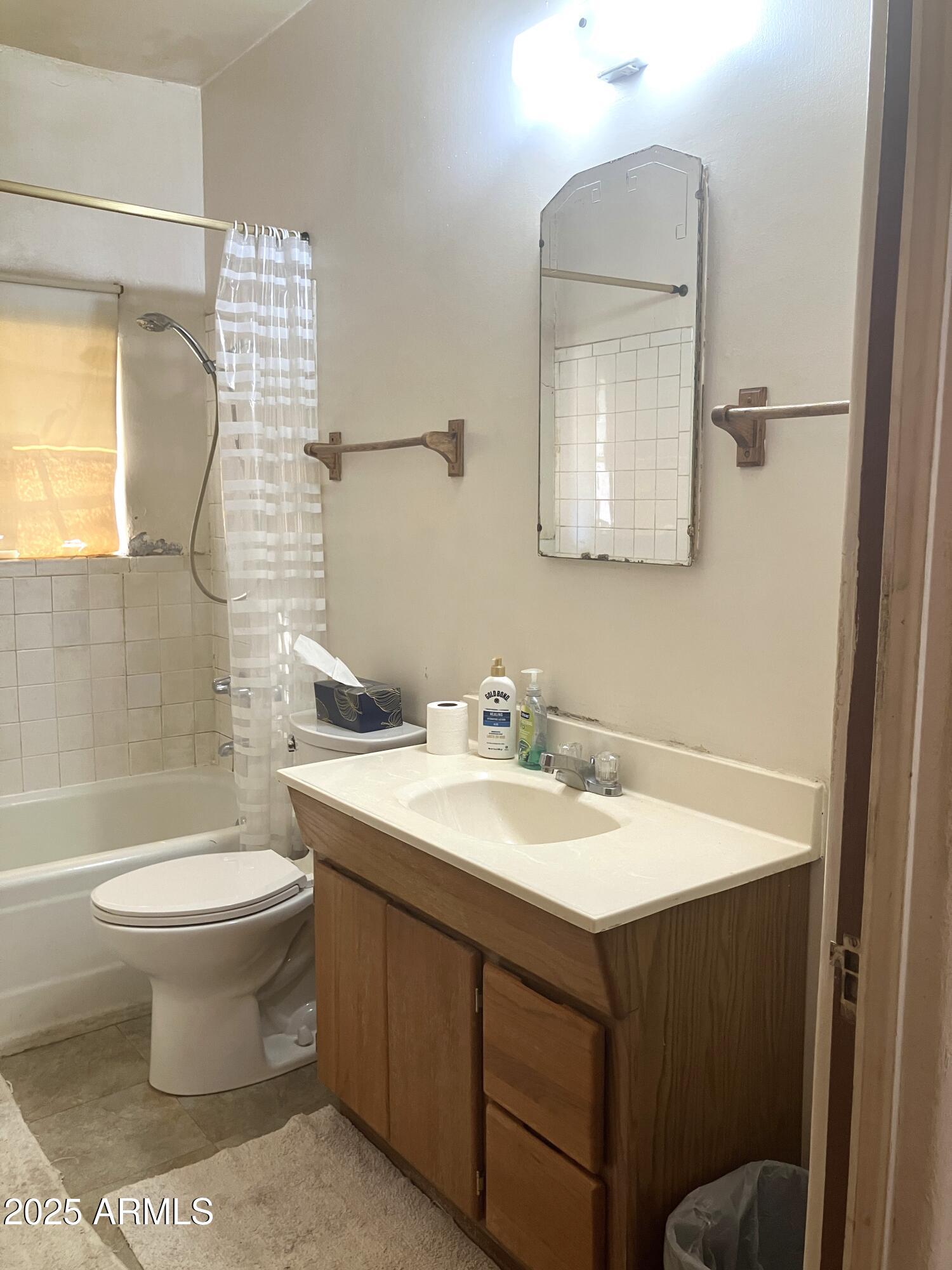 1637 East Roma Avenue Phoenix, AZ 85016 - Photo 32 of 78 a bathroom with a sink and a mirror