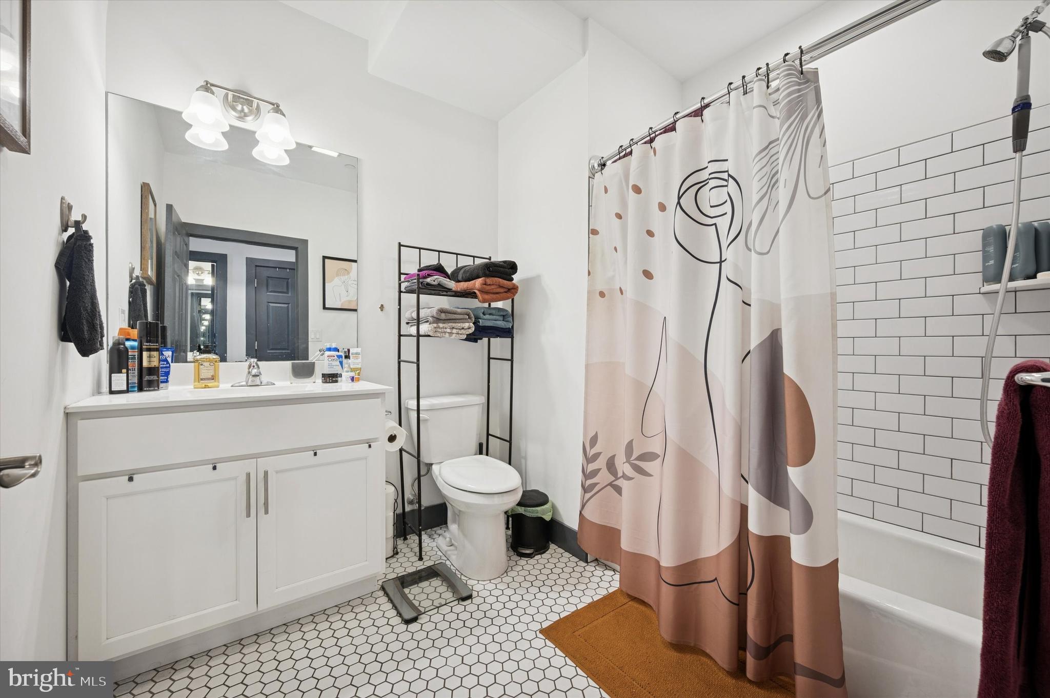 124-26 Levering Street, Unit 2A Philadelphia, PA 19127 - Photo 13 of 18 a bathroom with a sink toilet and shower