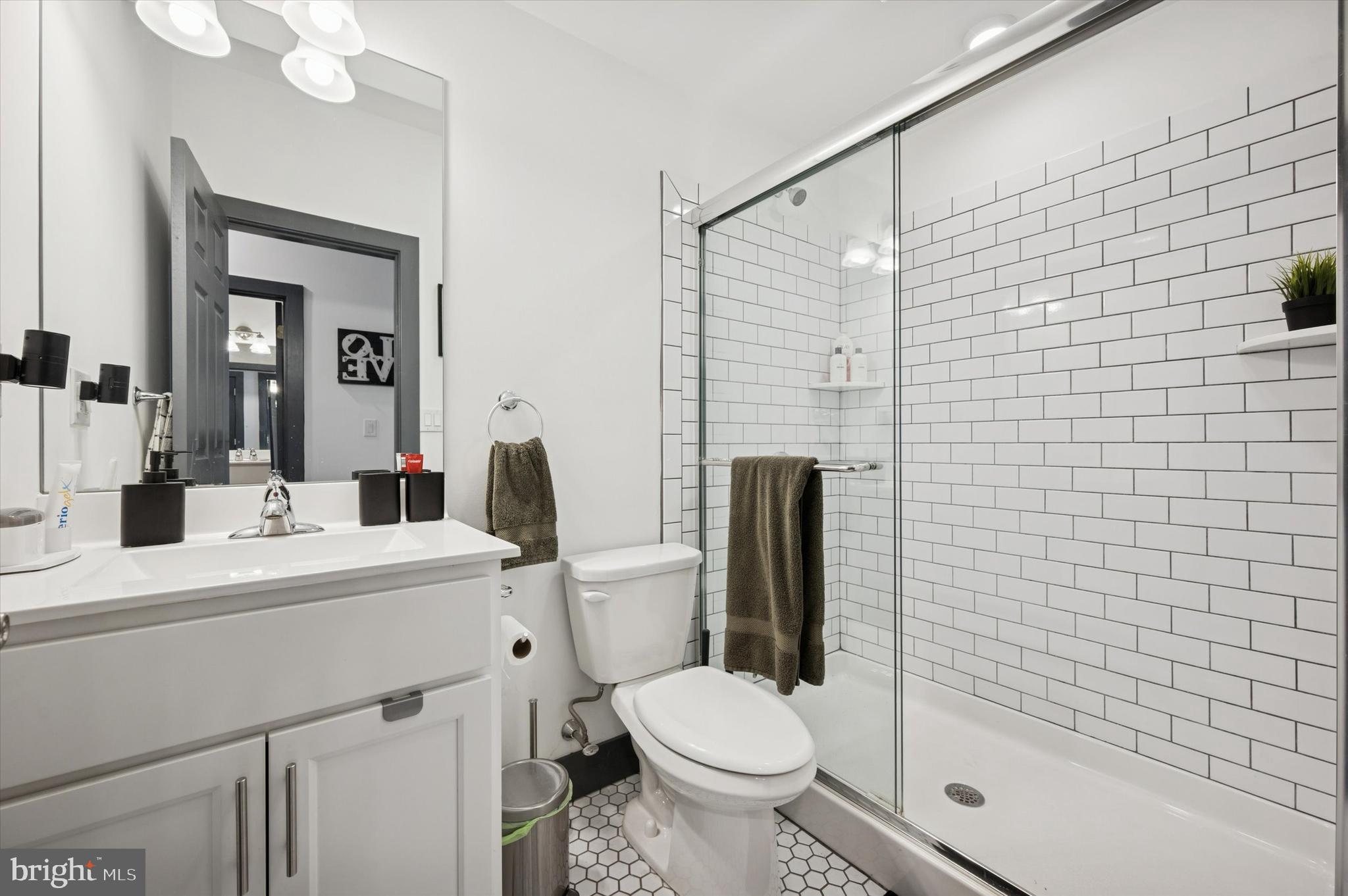 124-26 Levering Street, Unit 2A Philadelphia, PA 19127 - Photo 9 of 18 a bathroom with a sink toilet and shower