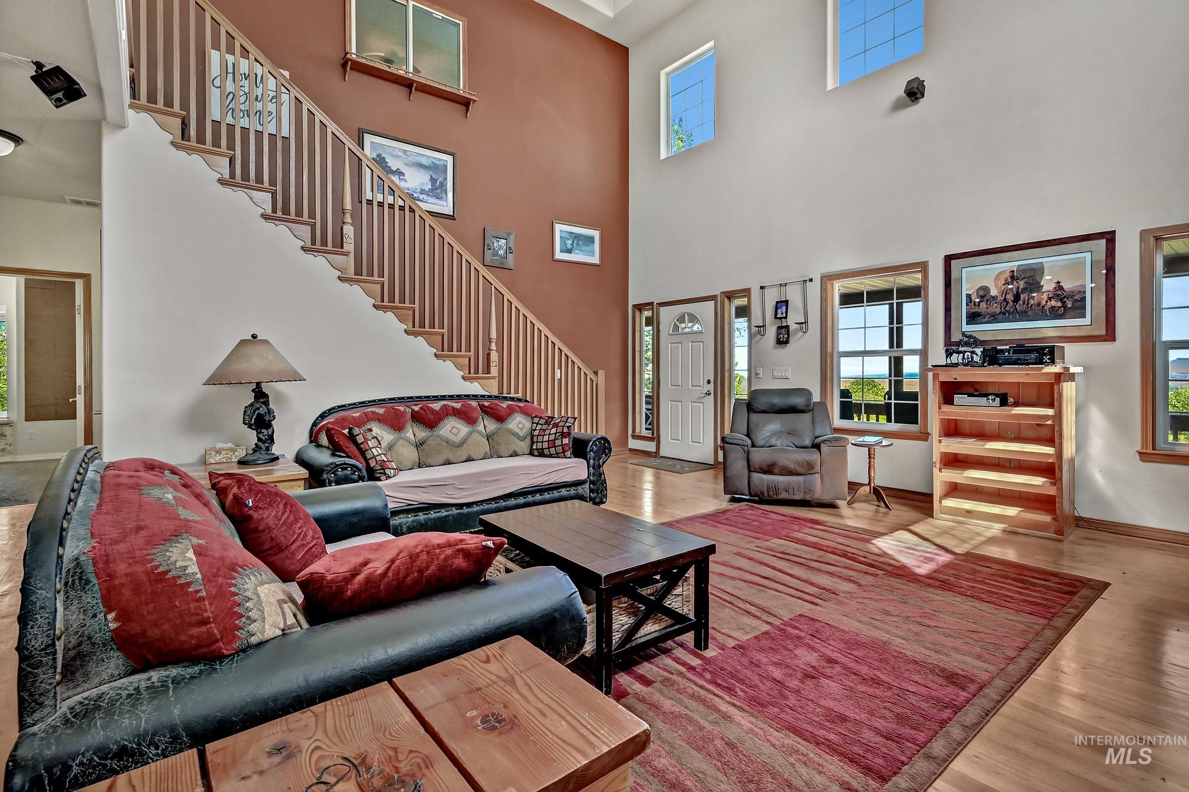 7213 East Columbia Road Boise, ID 83716 - Photo 13 of 47 Living area featuring soaring ceilings and natural wood-finish flooring