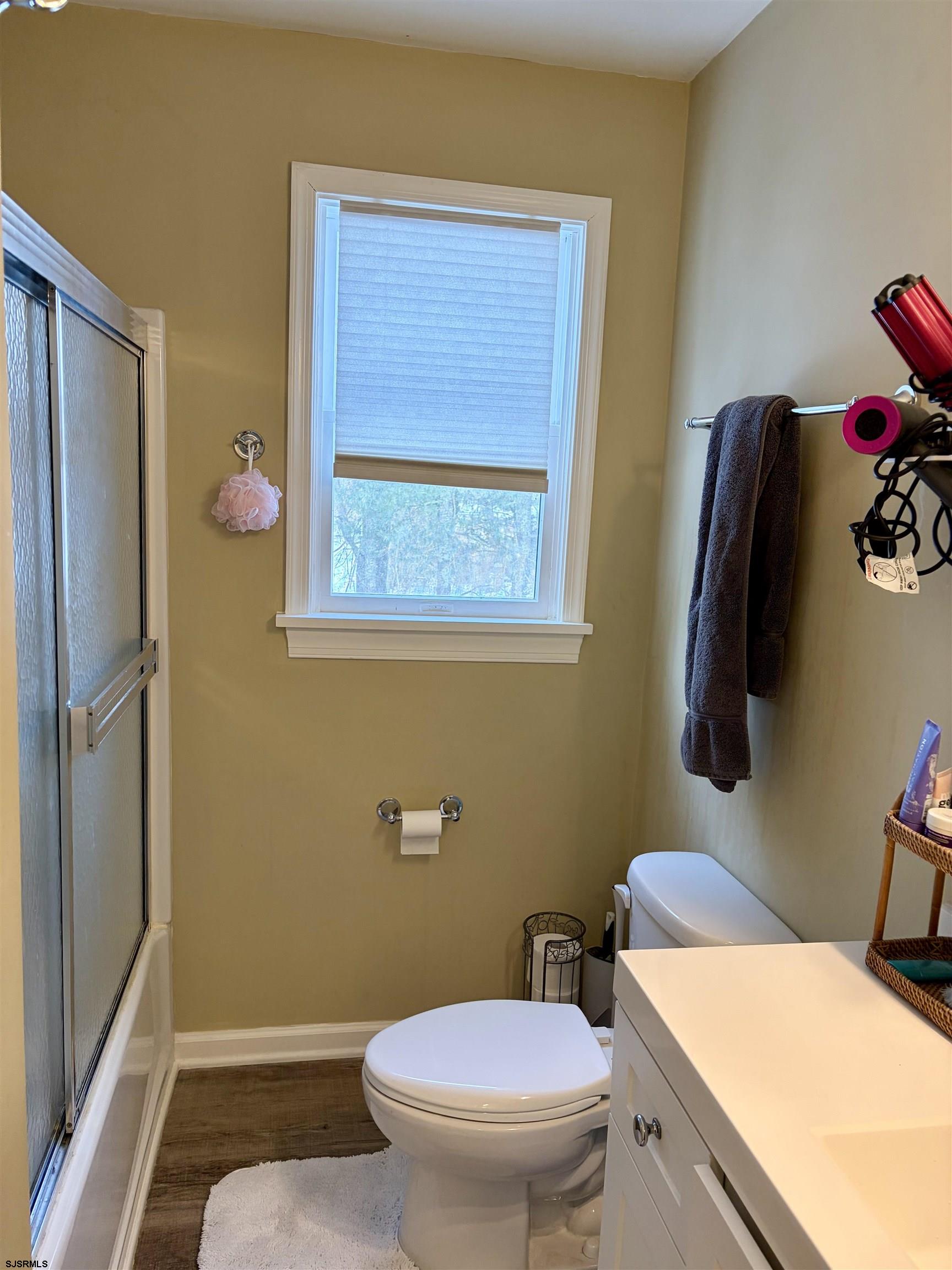155 Chestnut Street Woodbine, NJ 08270 - Photo 16 of 18 a bathroom with a toilet and a shower curtain