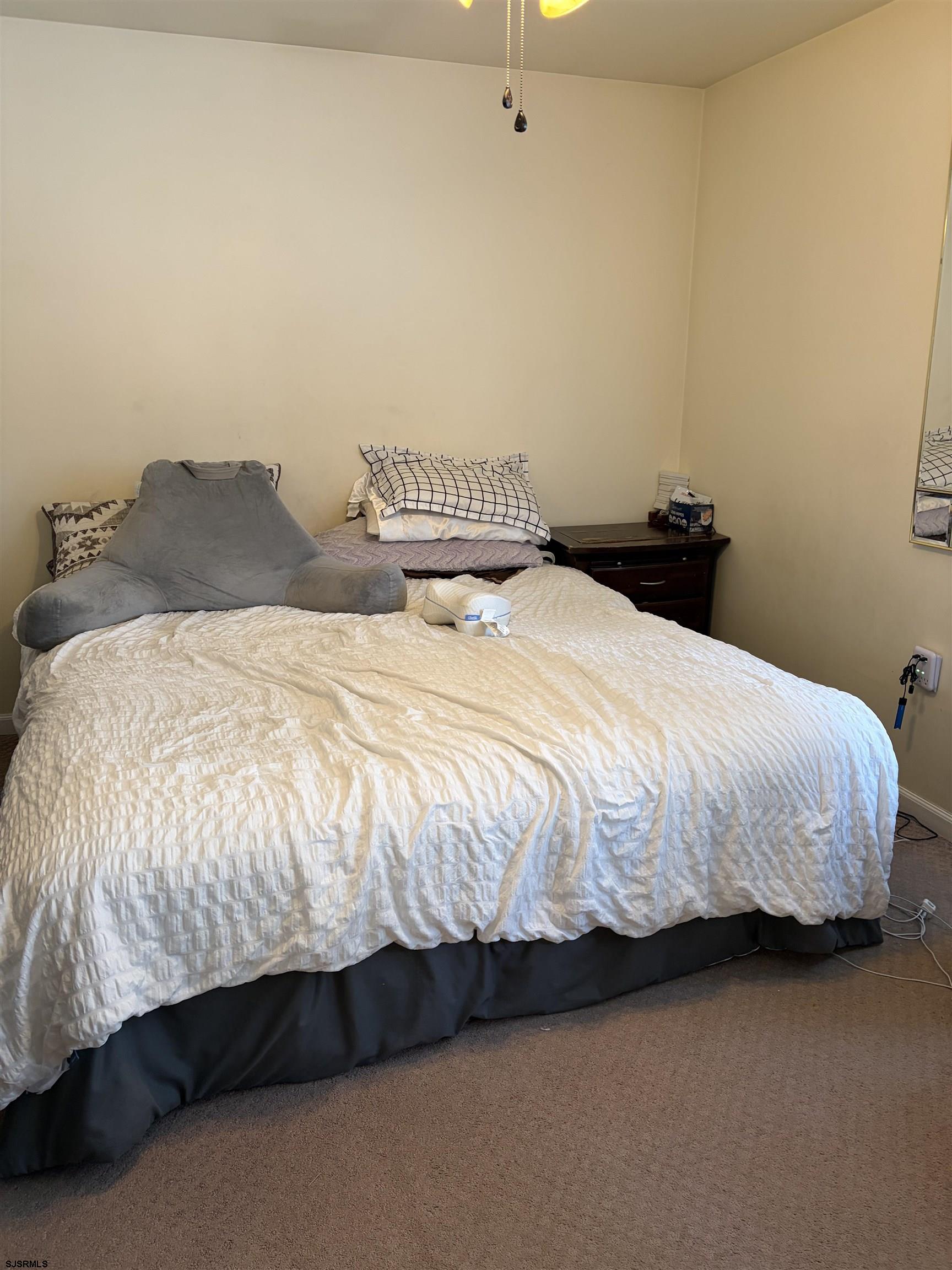 155 Chestnut Street Woodbine, NJ 08270 - Photo 17 of 18 a bedroom with a bed and lamp